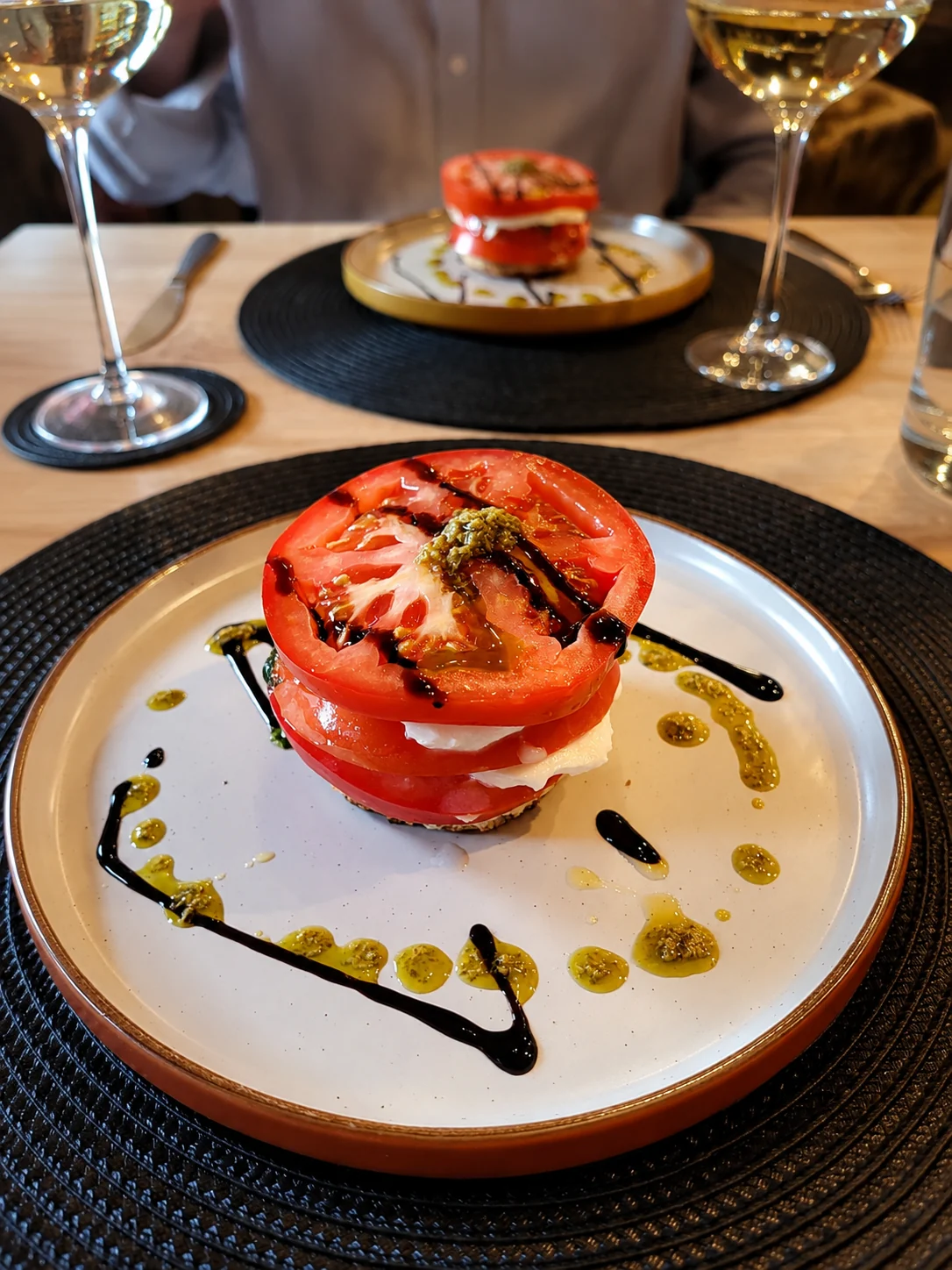 Tomato and mozzarella stack served with basil dressing