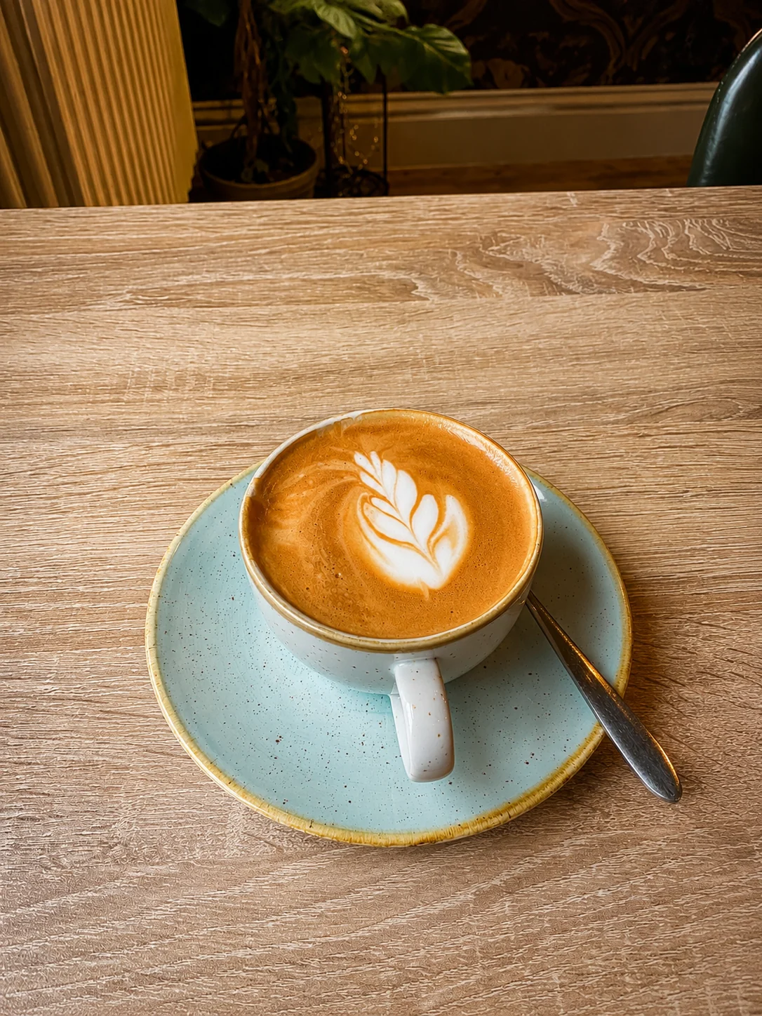 Latte with leaf art served at The Vines
